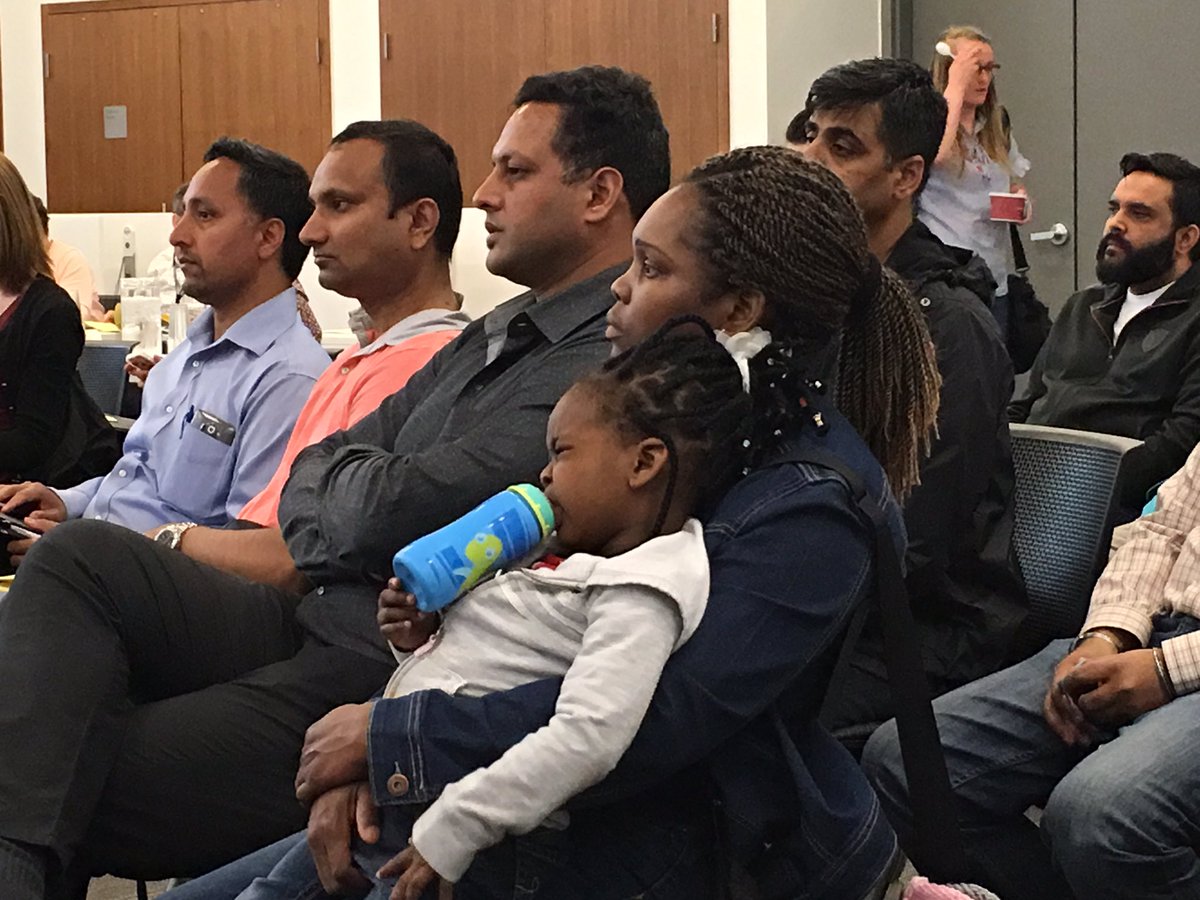Concerned parents over the CBE busing plan sit during a public hearing on Tuesday