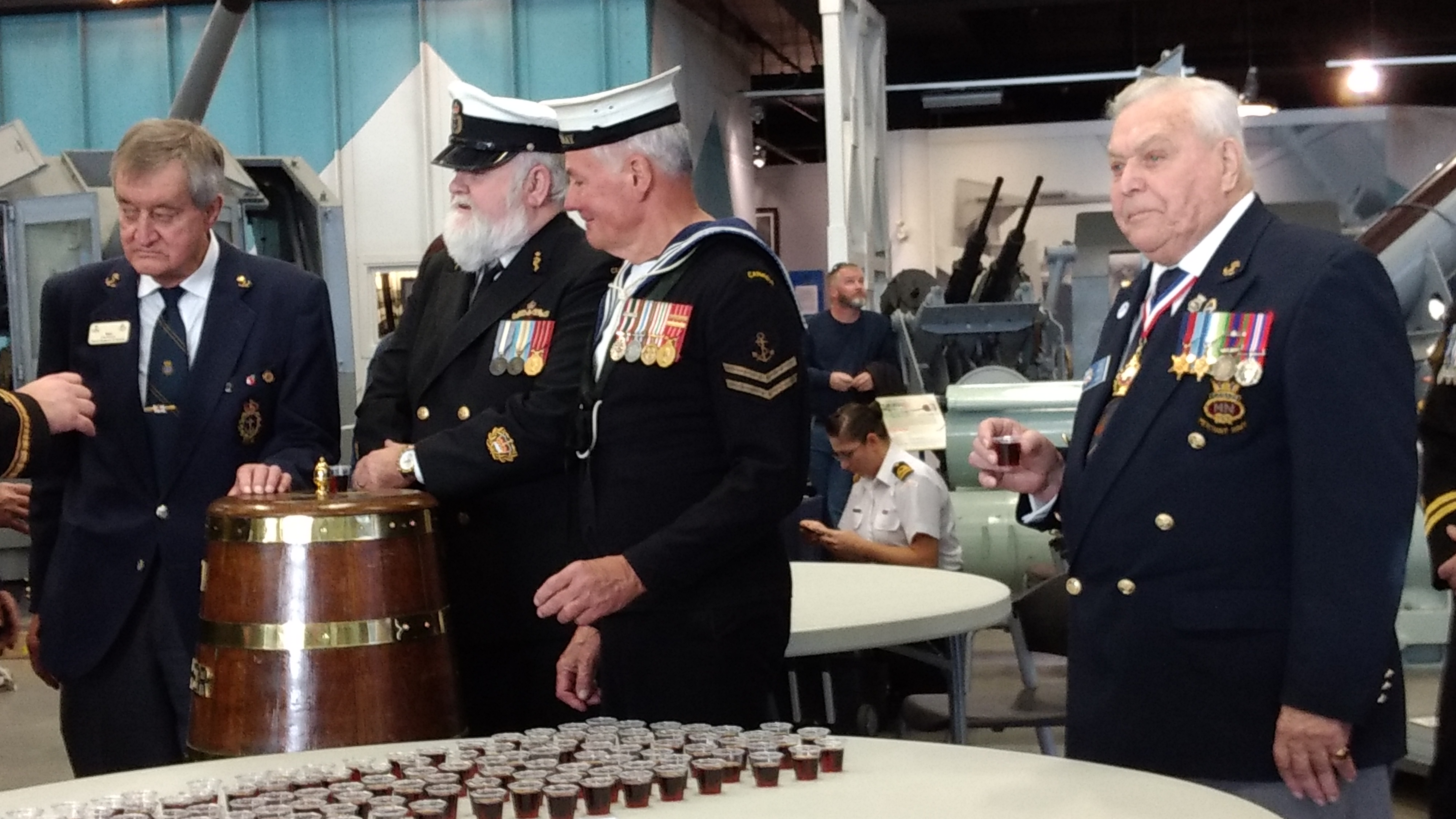 Veterans, including Petty Officer Lorne Baird, centre, get ready to splice the mainbrace and toast the Royal Canadian Navy. Sunday, October 23, 2016